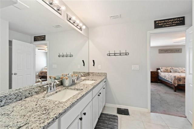 bathroom with ceiling fan, vanity, and tile patterned flooring