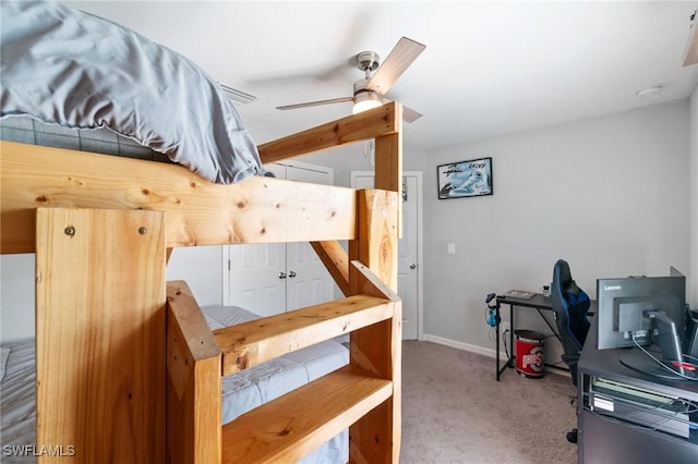 interior space with carpet floors and ceiling fan