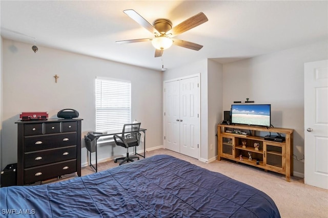 bedroom with light colored carpet, a closet, and ceiling fan