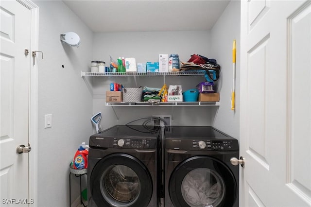 clothes washing area with independent washer and dryer