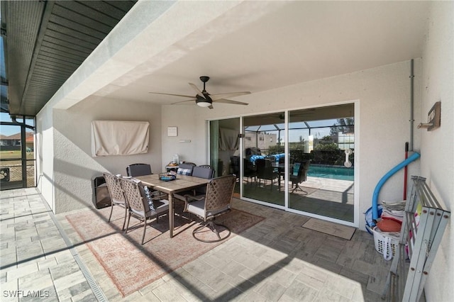 view of patio with a lanai and ceiling fan