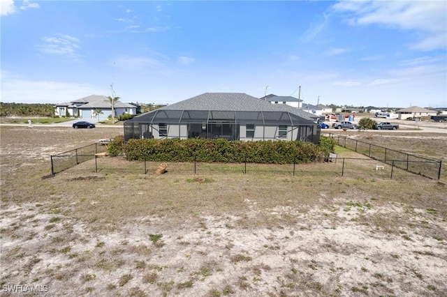 back of property with glass enclosure