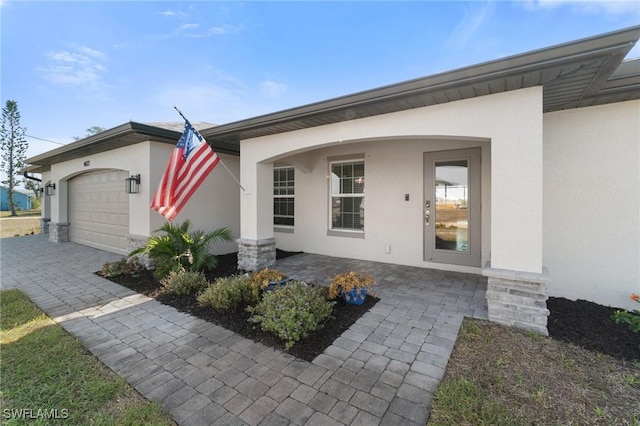 doorway to property featuring a garage