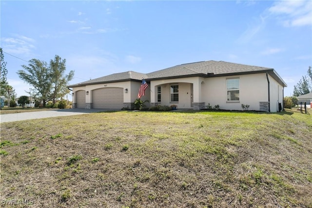 view of front of house featuring a garage and a front lawn