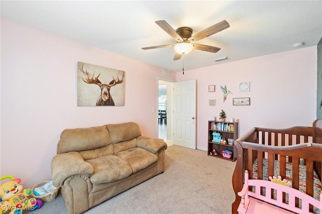 bedroom featuring ceiling fan and carpet floors