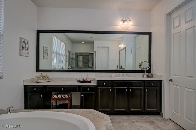 bathroom featuring vanity and separate shower and tub