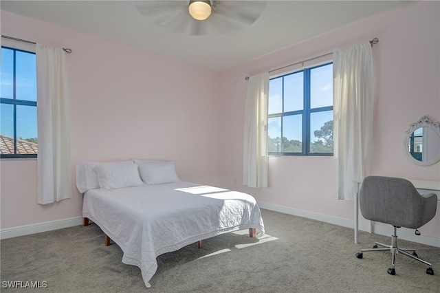 bedroom with light colored carpet and ceiling fan