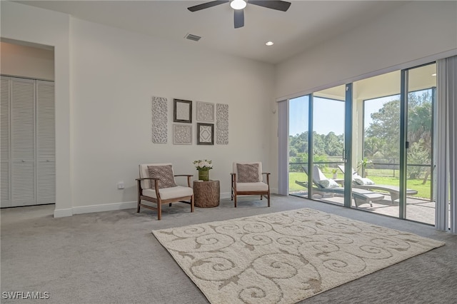 sitting room with light carpet and ceiling fan