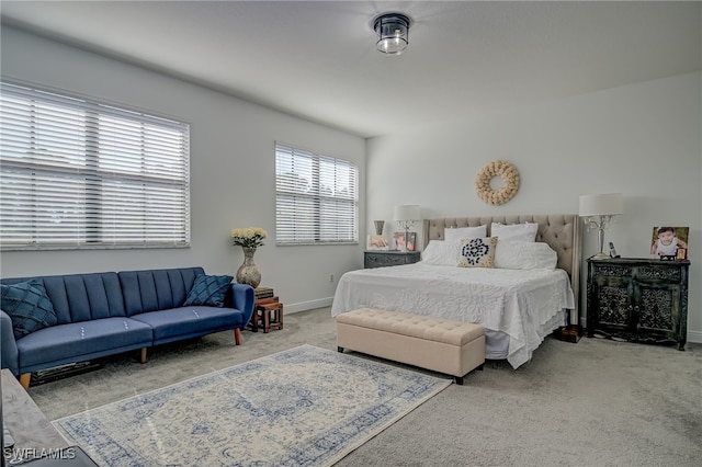 bedroom featuring light carpet