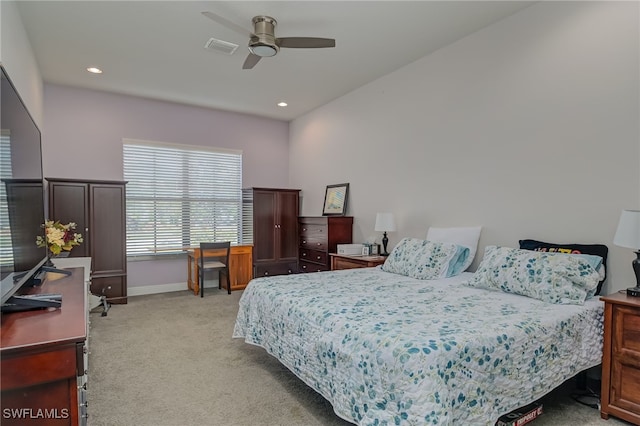 bedroom with light colored carpet and ceiling fan