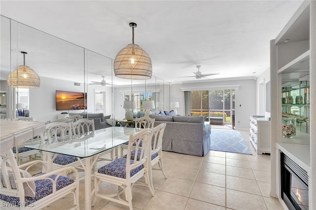 tiled dining room with ceiling fan