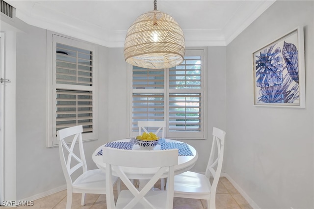 dining area with light tile patterned floors and ornamental molding