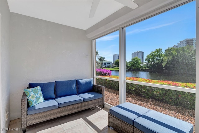 sunroom / solarium with a water view