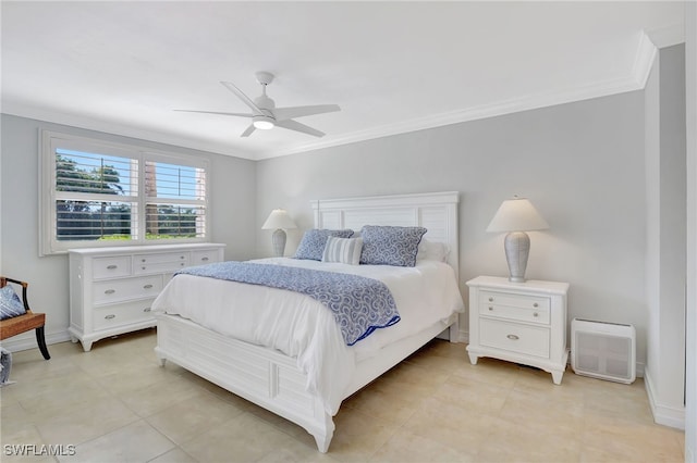 bedroom with ornamental molding and ceiling fan