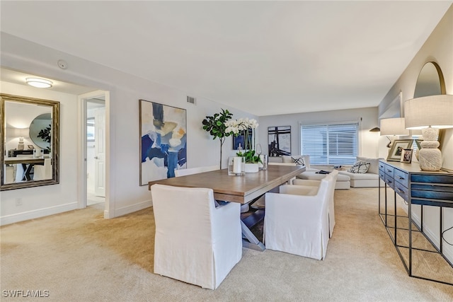 view of carpeted dining space