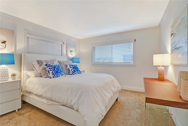 bedroom with light colored carpet