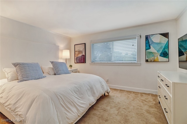 bedroom with light carpet and crown molding