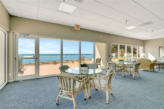 sunroom with a water view