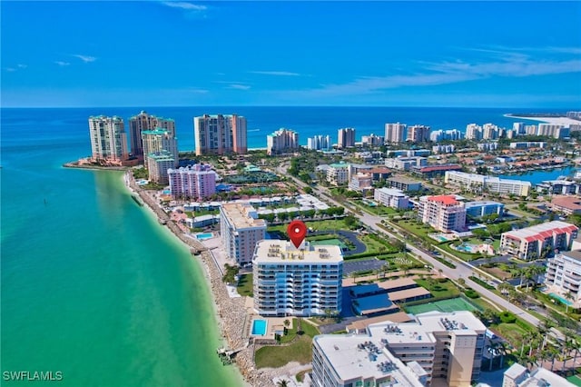 bird's eye view featuring a water view and a view of the beach