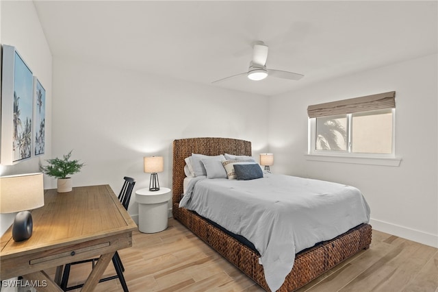 bedroom featuring light hardwood / wood-style floors and ceiling fan