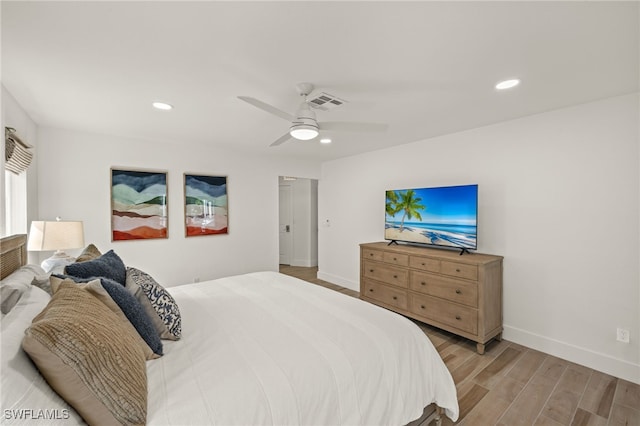 bedroom with light wood-type flooring and ceiling fan