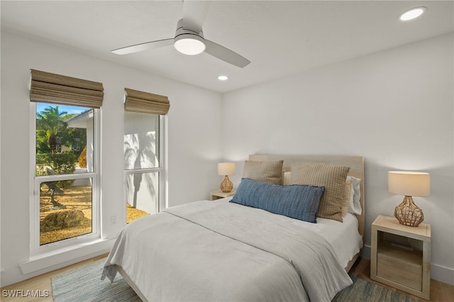 bedroom featuring hardwood / wood-style floors and ceiling fan