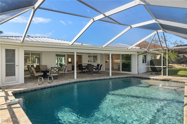 view of pool with a lanai and a patio area