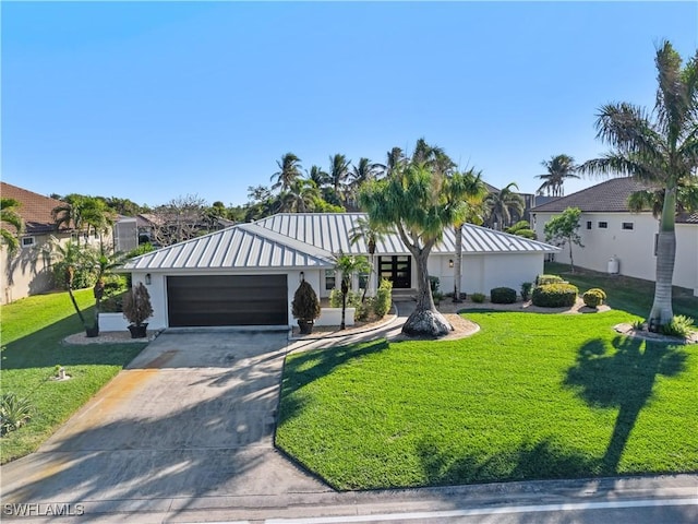 view of front of home with a garage and a front yard