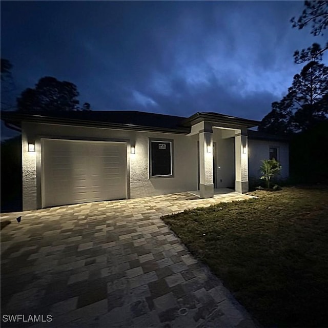 view of front of property featuring a garage