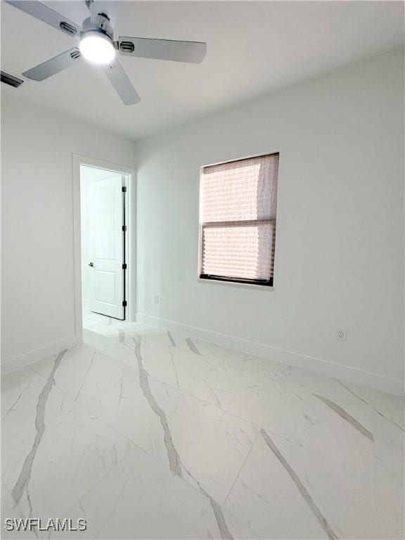 empty room featuring ceiling fan