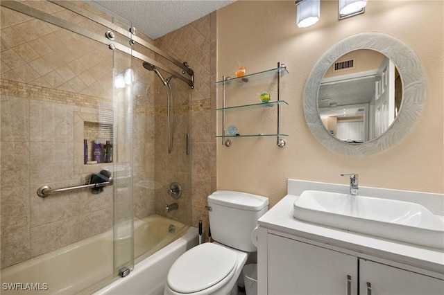 bathroom featuring visible vents, toilet, shower / bath combination with glass door, a textured ceiling, and vanity