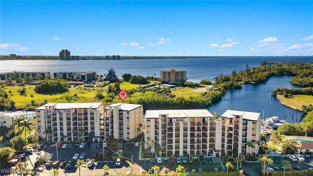 birds eye view of property featuring a water view