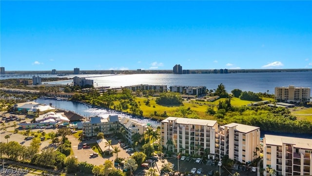 aerial view featuring a water view and a view of city