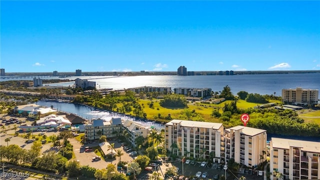 drone / aerial view with a water view and a city view