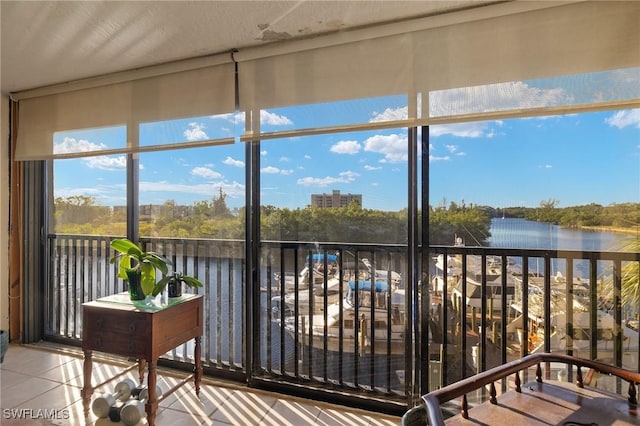 sunroom / solarium with a water view