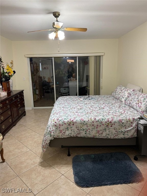 bedroom with light tile patterned floors, ceiling fan, and a closet