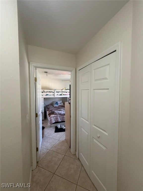 hall featuring light tile patterned floors