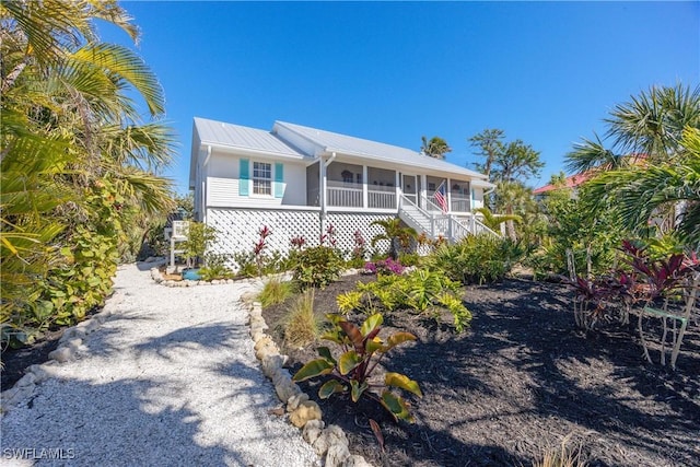 view of front of house featuring a sunroom