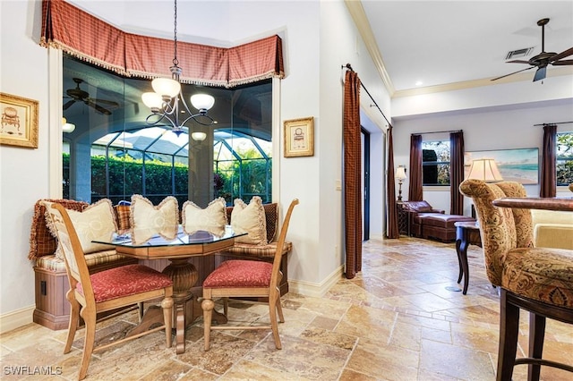 dining space featuring ceiling fan and ornamental molding