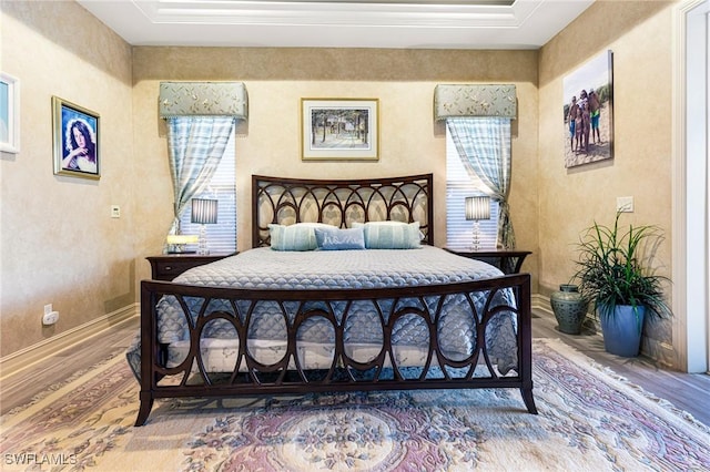 bedroom with hardwood / wood-style flooring