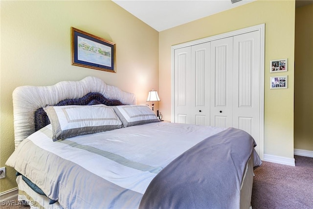 carpeted bedroom featuring a closet