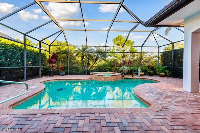 view of swimming pool with an in ground hot tub, a lanai, and a patio