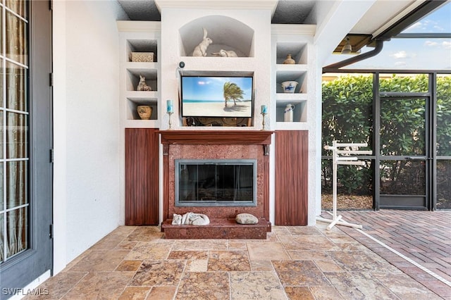 unfurnished living room featuring built in features