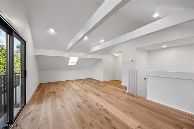 bonus room with vaulted ceiling with beams, light wood finished floors, recessed lighting, radiator heating unit, and baseboards