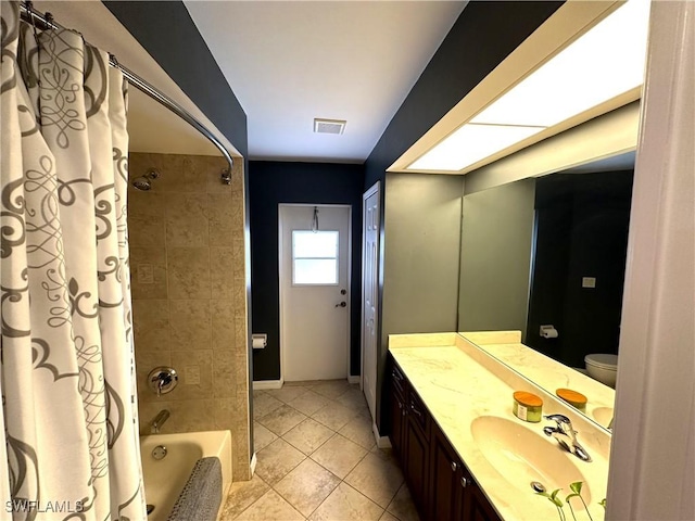 full bathroom with vanity, toilet, tile patterned flooring, and shower / bath combo