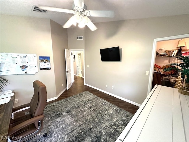 office space featuring dark wood-type flooring and ceiling fan