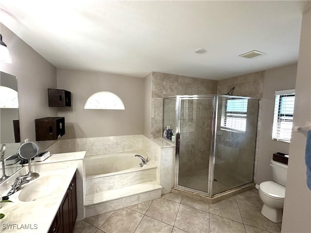 full bathroom with tile patterned flooring, vanity, independent shower and bath, and toilet