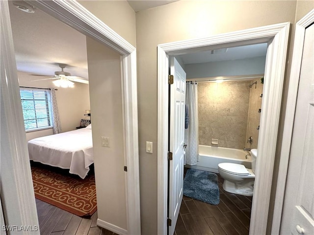 bathroom featuring toilet, ceiling fan, and shower / bath combo with shower curtain