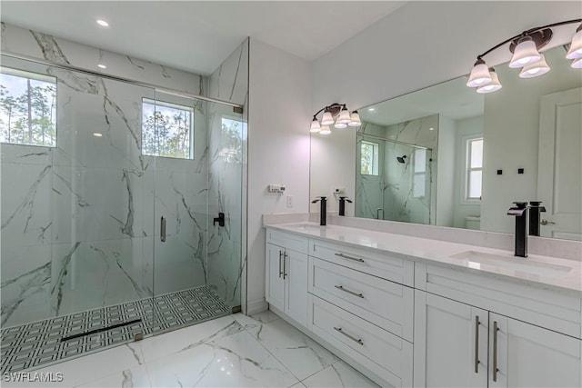 bathroom with vanity, plenty of natural light, a shower with shower door, and toilet