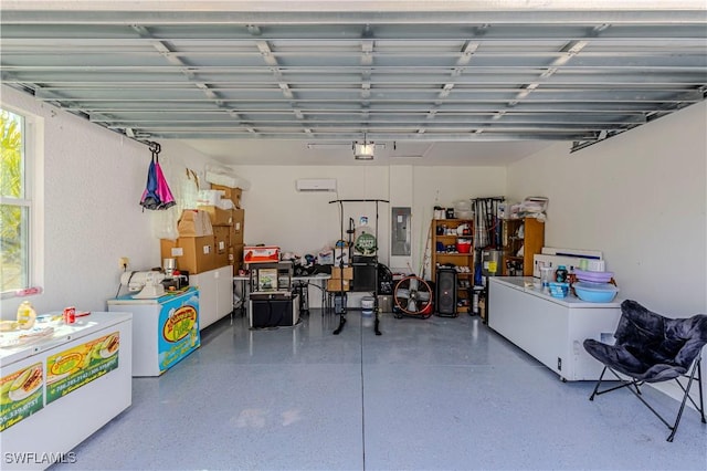 garage with a garage door opener and electric panel